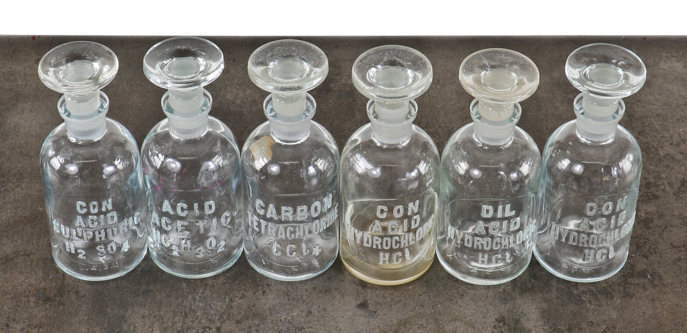 original c. 1930's american depression era antique industrial scientific research laboratory embossed reagent bottles with oversized disc-shaped ground glass stoppers