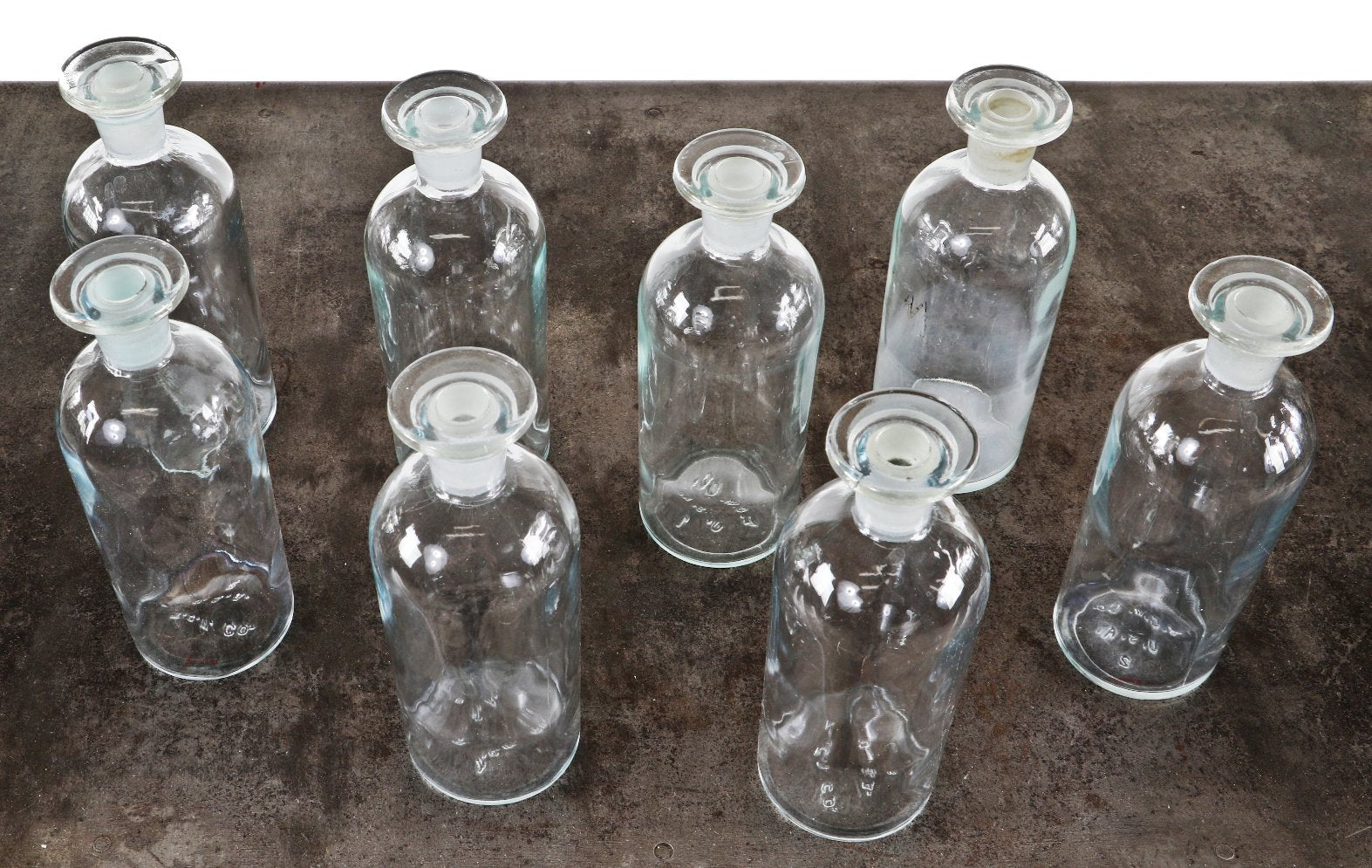 large lot of vintage american unembossed university of chicago research laboratory clear glass reagent bottles with original disc-shaped ground glass stoppers
