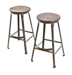one of two matching original and intact american industrial late 1930's or 1940's refinished riveted joint stationary aeronautics factory stool with protruding footrest