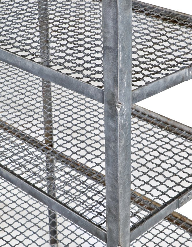 late 1930's american industrial custom-built brushed metal stationary oversized riveted joint four-tier shelving unit with detachable corrugated wire shelves