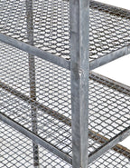 late 1930's american industrial custom-built brushed metal stationary oversized riveted joint four-tier shelving unit with detachable corrugated wire shelves