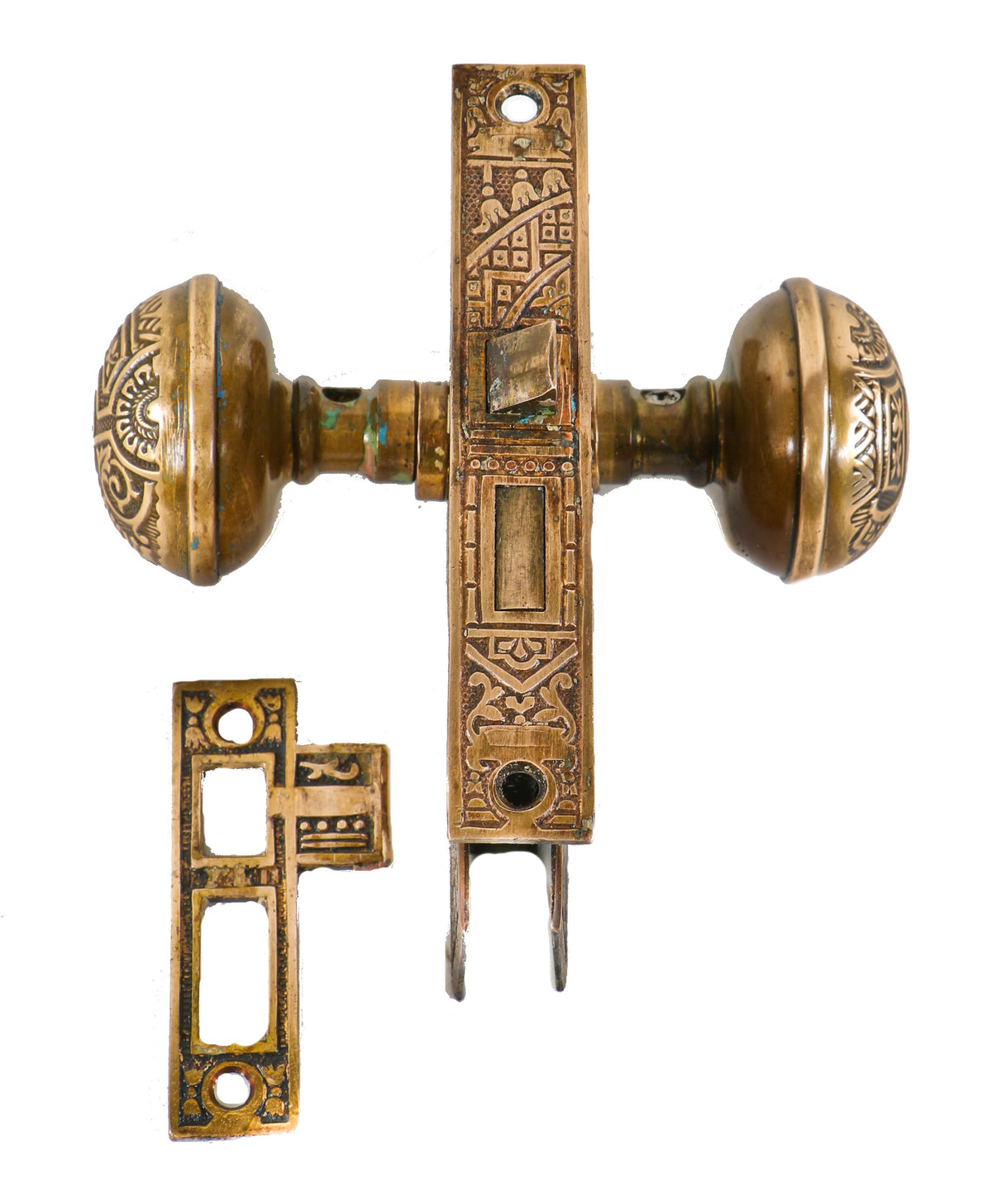 original and completely intact c. 1880's american eastlake style ornamental wrought brass "ceylon" pattern interior residential doorknob lockset with matching strike plate
