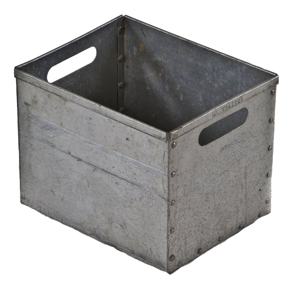 original and fully functional depression era american industrial pressed and folded riveted joint metal crate or storage bin with opposed handles