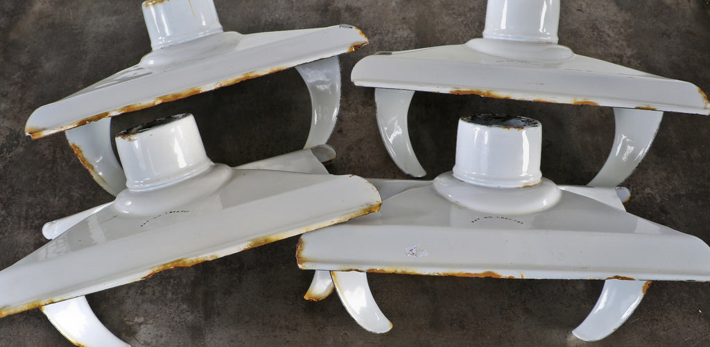 single highly desirable c. 1930's chicago public library white porcelain enameled cold-rolled steel reflector with an aperture in the center for the reception of the lamp base