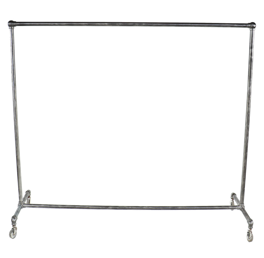 original and intact oversized depression era american industrial heavy duty mobile threaded steel pipe garment rack with bulbous fittings and bassick swivel casters