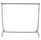 original and intact oversized depression era american industrial heavy duty mobile threaded steel pipe garment rack with bulbous fittings and bassick swivel casters