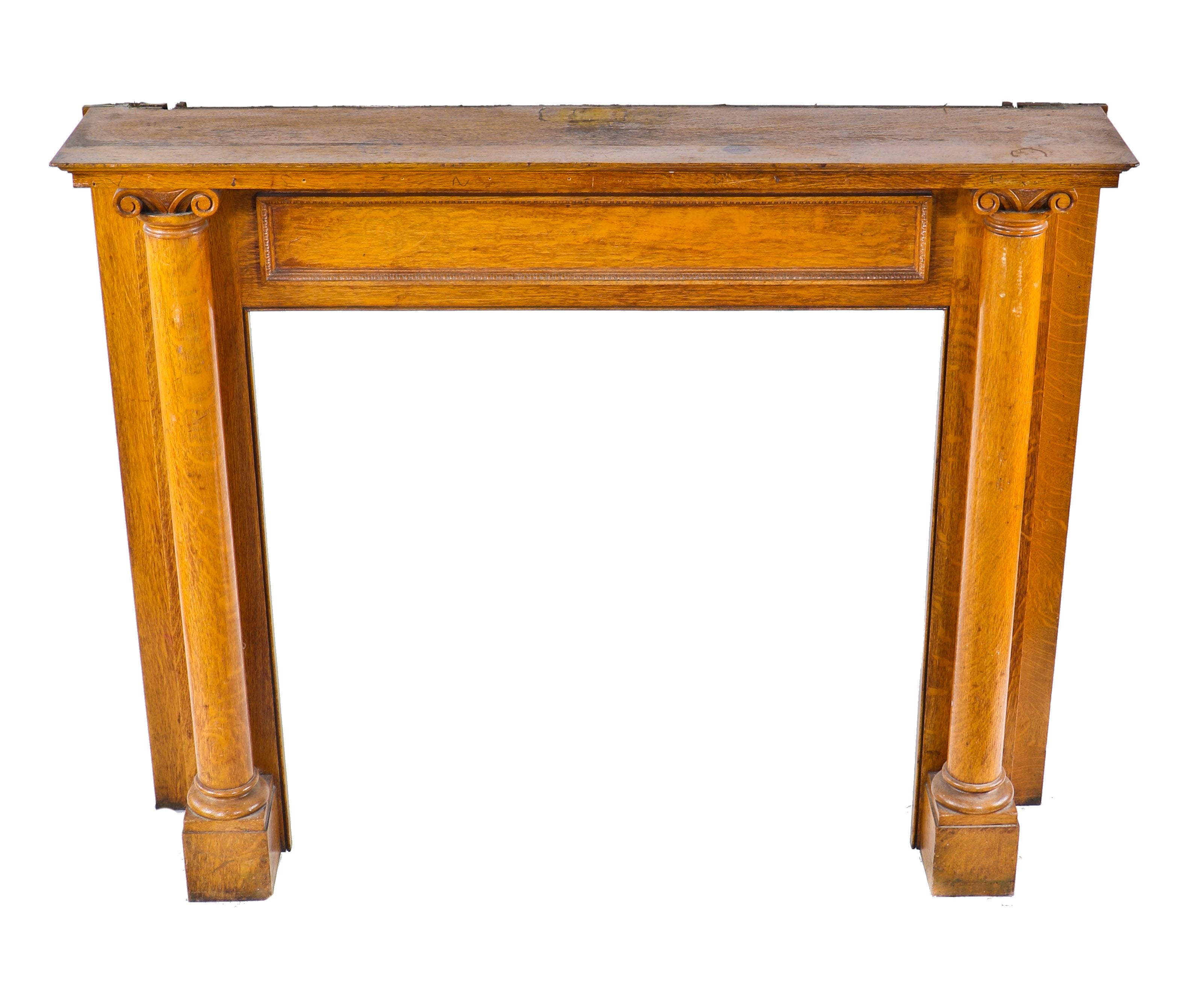 original well-maintained early 20th century varnished quartered oak wood interior residential front parlor fireplace mantel with solid round columns