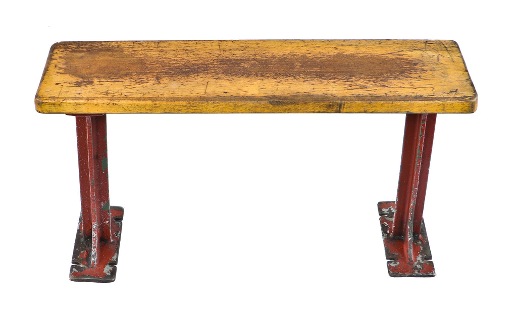 depression era antique american industrial salvaged stationary low-lying chicago foundry building locker room sitting bench with reinforced red painted cast iron legs