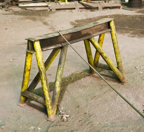 two matching incredibly heavy duty original late 1930's american industrial weathered and worn painted all-welded joint foundry steel sawhorse bases
