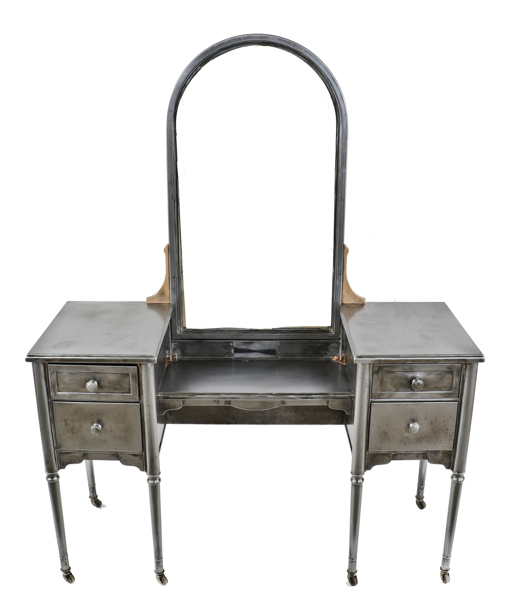 original c. 1930's completely refinished pressed and folded turned and tapered brushed steel "simmons" vanity with original tilting arch top mirror