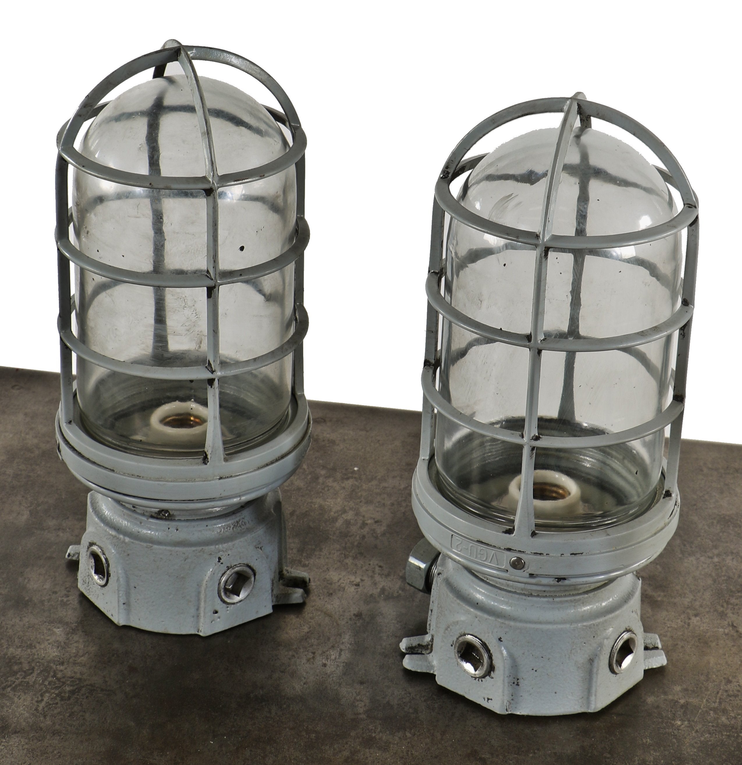 two matching oversized c. 1950's american vintage industrial chicago foundry "explosion proof" wall-mount electric sconces with detachable cages