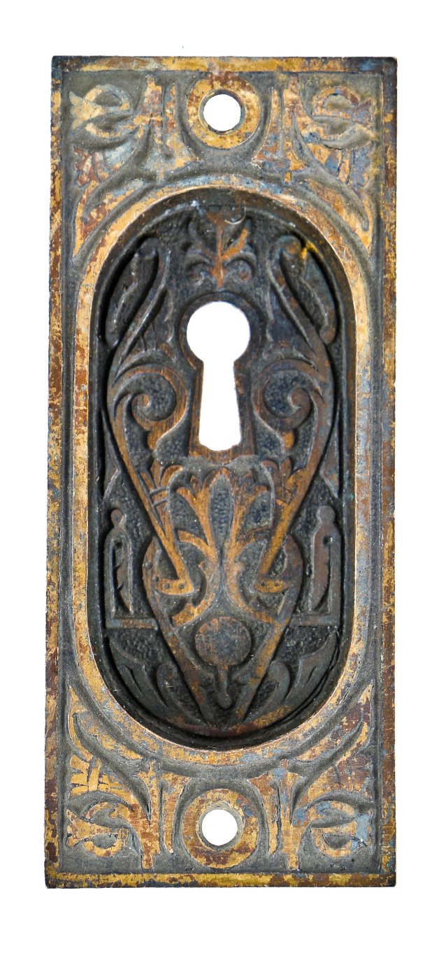 19th century ornamental cast iron interior residential pocket door backplate or escutcheon with deeply recessed handle and largely intact brass-plated finish