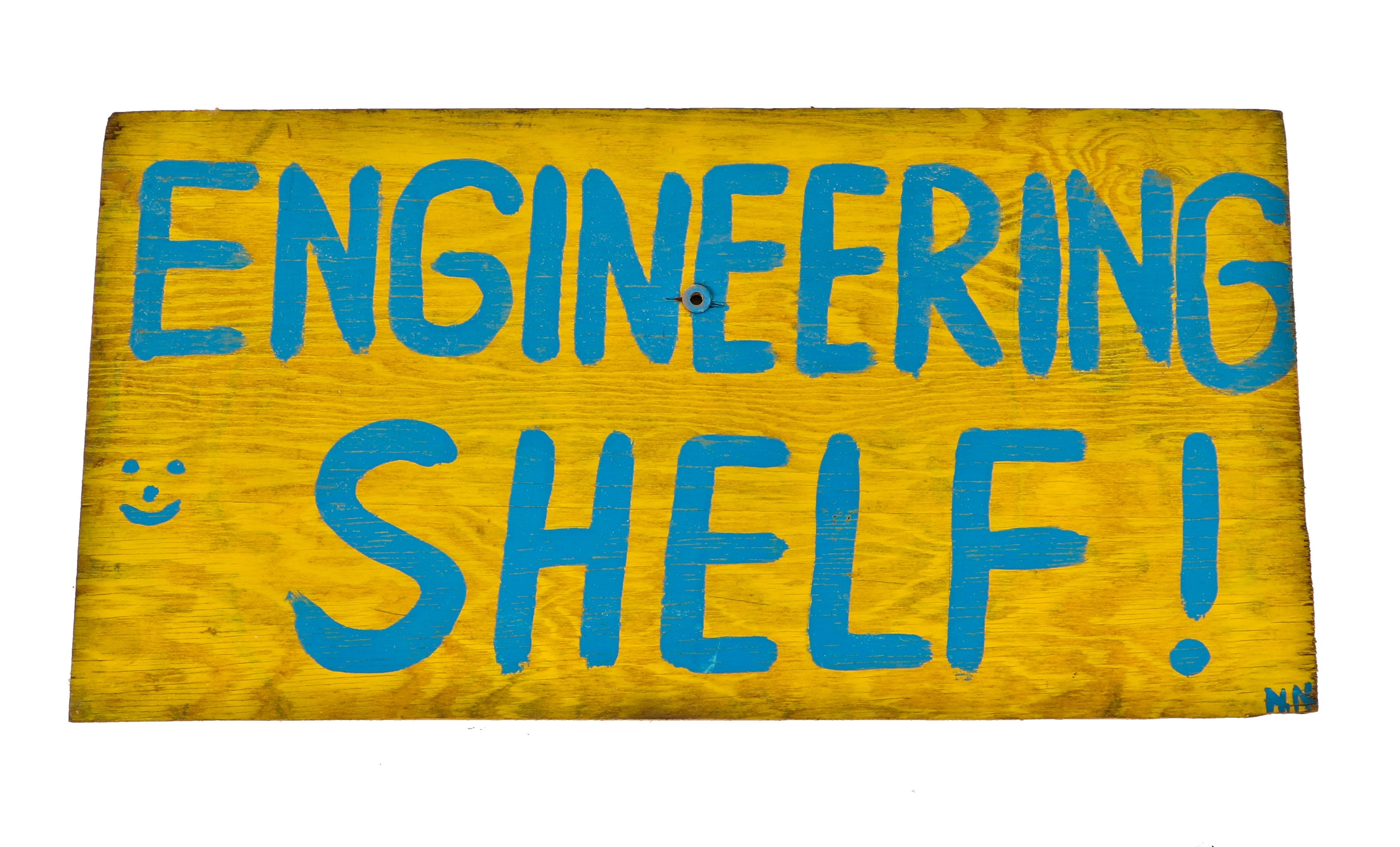 original and brightly colored hand-painted american industrial folk art single-sided "engineering shelf" wood sign with bold blue lettering against a yellow background