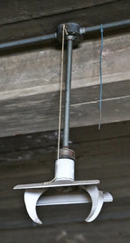 completely intact and fully functional early 1940's uniquely-shaped white porcelain enameled goodrich factory pendant light with swivel-joint canopies