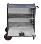 c. 1940's refinished vintage low-lying mobile american industrial cold-rolled steel "warner" cabinet with drop-down door and hardened black rubber wheels