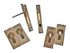 hard to find completely intact "windsor" pattern 19th century eastlake style cast iron and brass residential pocket door set with functional skeleton key