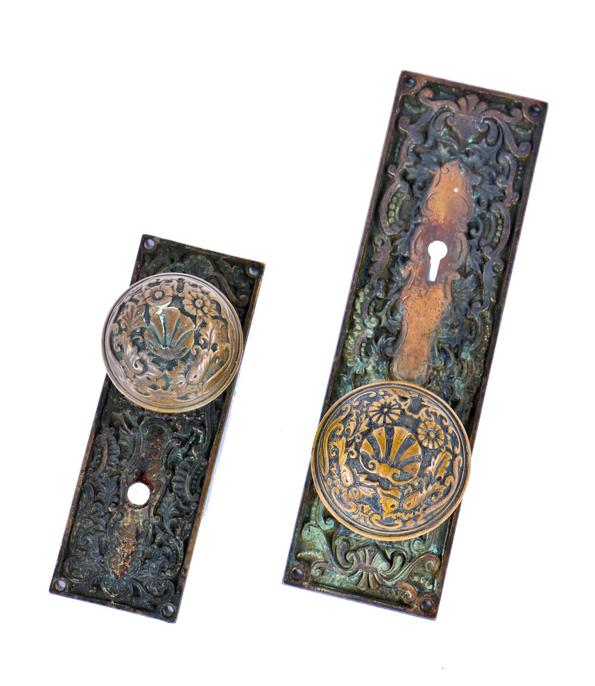 original and nicely aged late 19th or early 20th century heavily ornamented cast bronze residential entrance door hardware with oversized doorknob and backplate