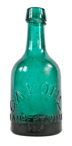 very crude original early 1850's largely intact antique american emerald green glass porter shaped bottle manufactured for george kohl in lambertville, new jersey.