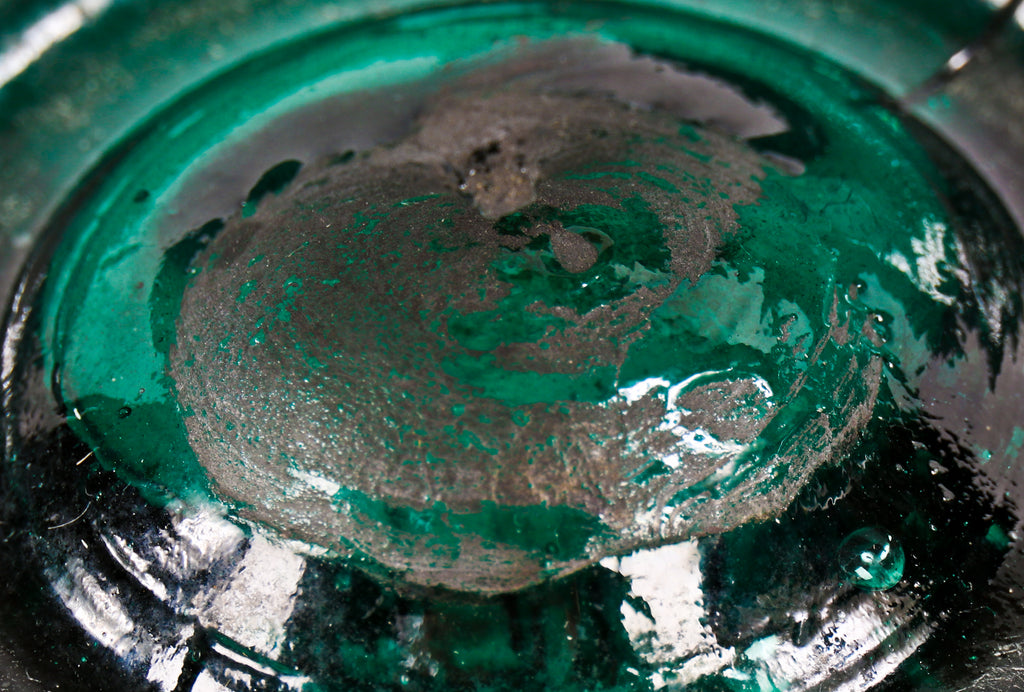very crude original early 1850's largely intact antique american emerald green glass porter shaped bottle manufactured for george kohl in lambertville, new jersey.