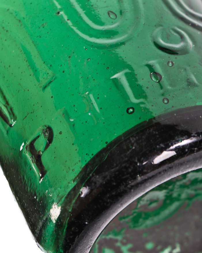 one of several c. 1850's iron-pontiled antique american richly colored emerald green glass soda bottle manufactured for philadelphia bottler eugene roussel.