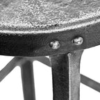 structurally sound and heavily reinforced late 1920's american antique industrial riveted-joint heavy gauge angled steel four-legged elevator machine room stool with brushed metal finish
