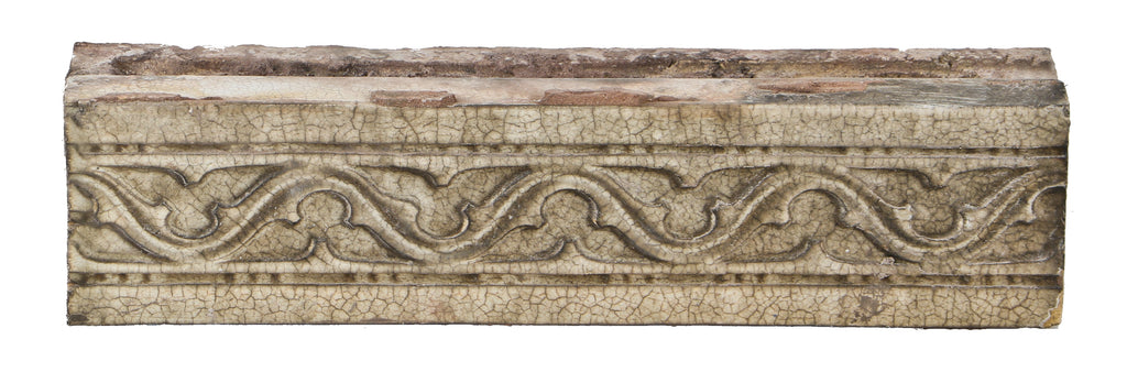 one of several all original early 20th century "sullivanesque" style rectangular-shaped white glazed terra cotta building facade blocks with repeating gothic trefoil design motif