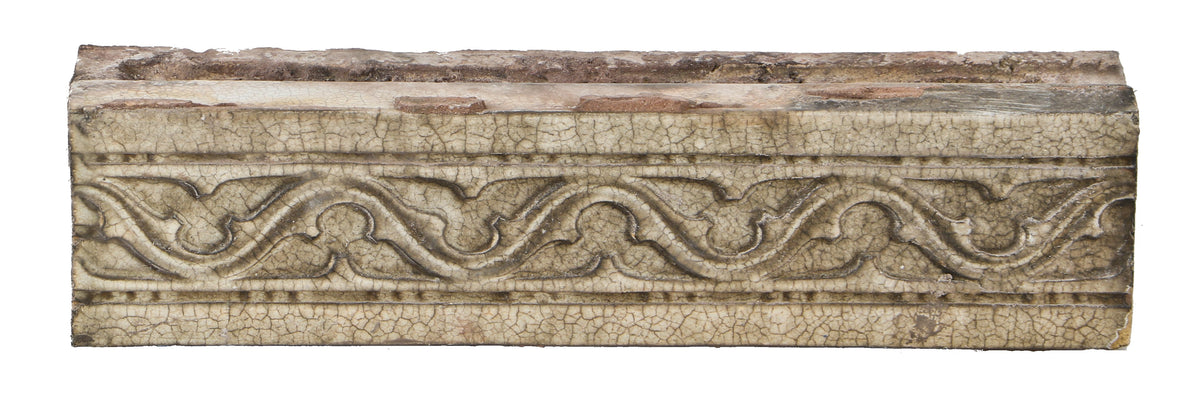 one of several all original early 20th century "sullivanesque" style rectangular-shaped white glazed terra cotta building facade blocks with repeating gothic trefoil design motif