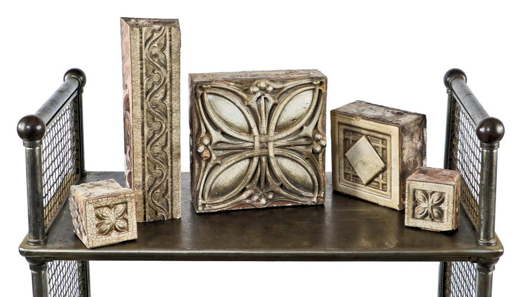 one of several all original early 20th century "sullivanesque" style rectangular-shaped white glazed terra cotta building facade blocks with repeating gothic trefoil design motif
