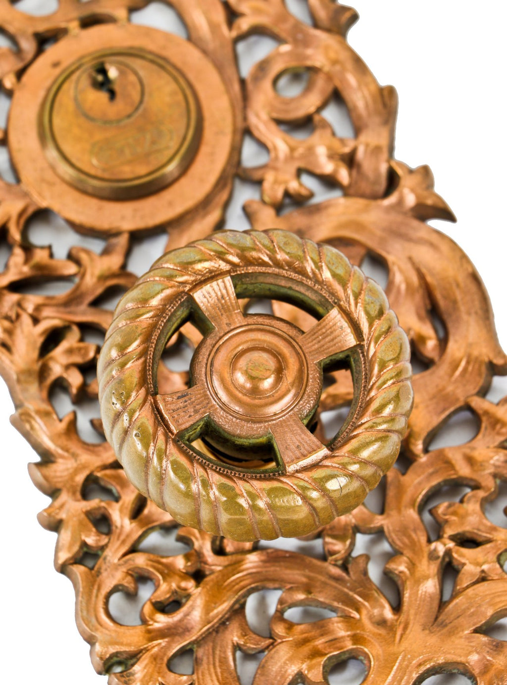 hard to find and highly sought after late 19th century original ornamental cast bronze "kelp" pattern entrance door backplate and matching spoked doorknob