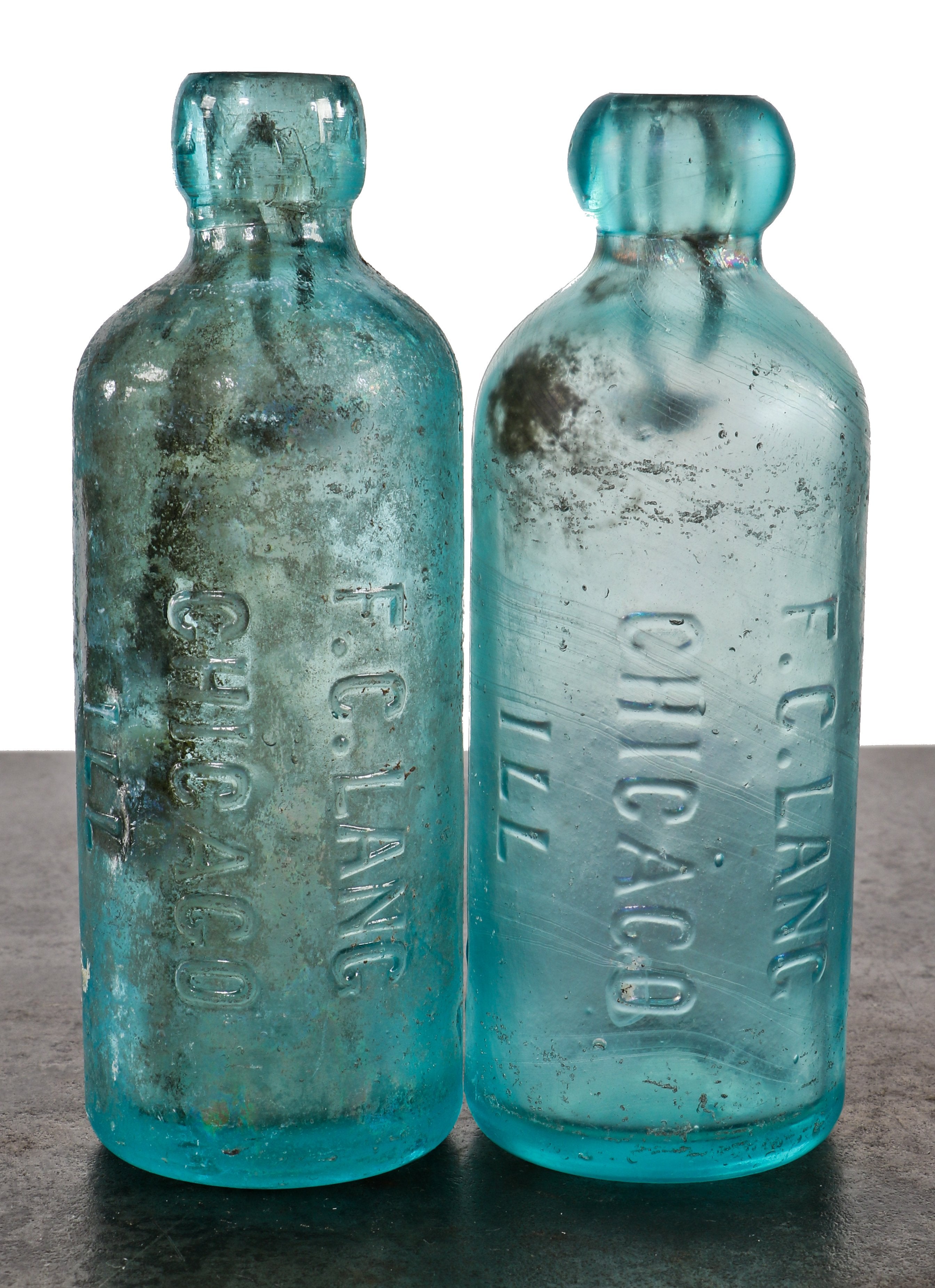 matching pair of rare and intact c. 1870s or 1880s privy dug matching deep blue aqua hutchinson soda bottles manufactured for chicago bottler frederick c. lang.