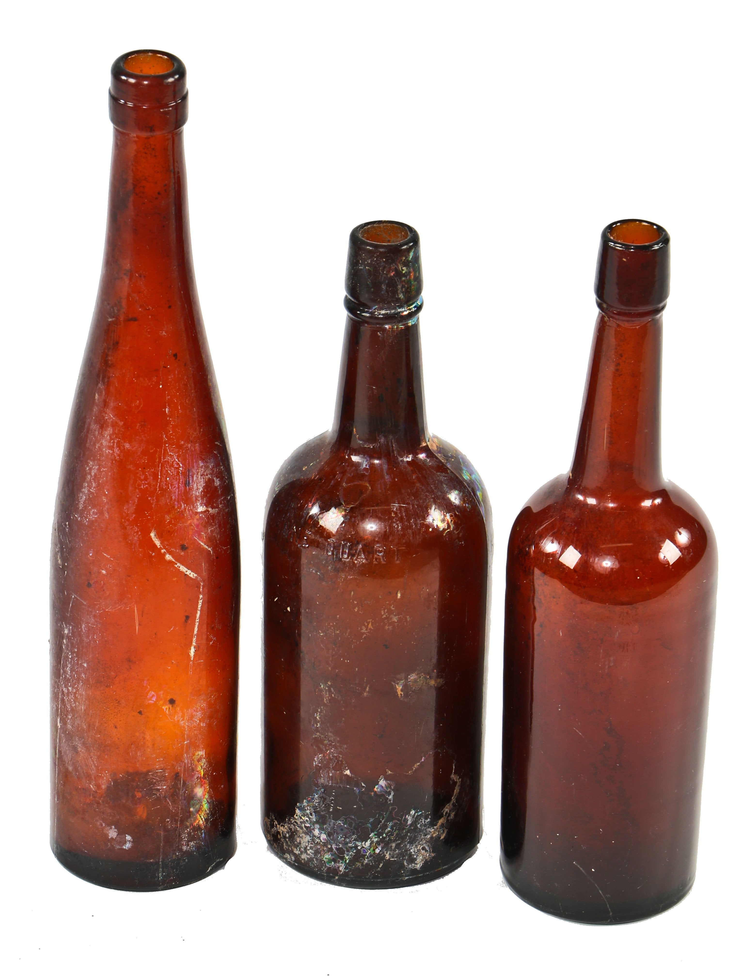 assortment of three hand-blown dark amber colored glass 19th century antique american oversized privy dug whiskey and wine bottles with applied lips