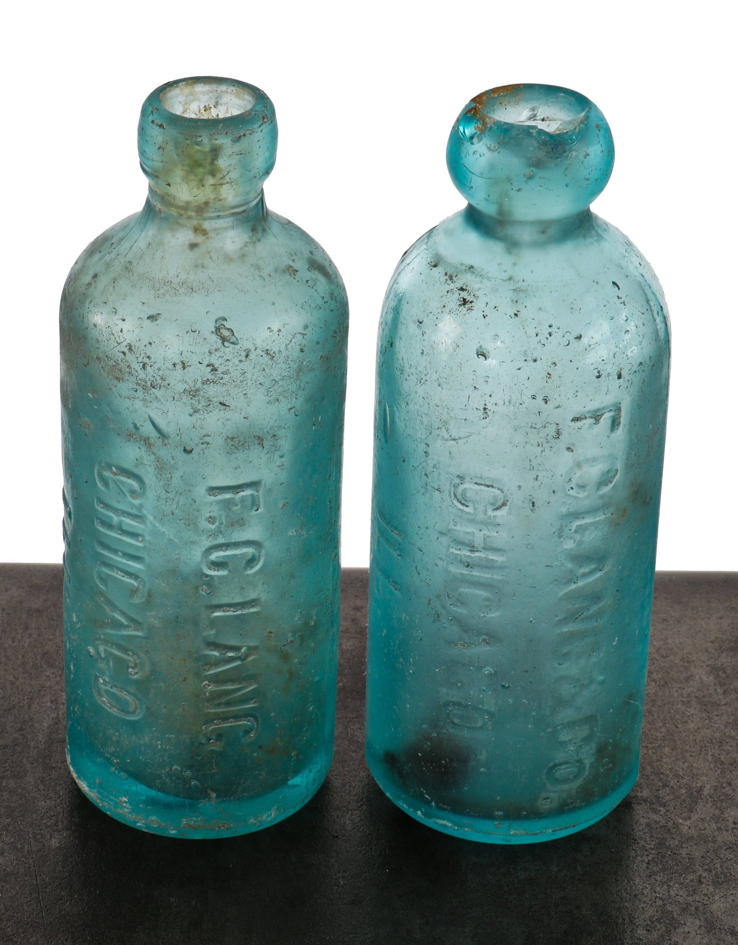 matching pair of rare and intact c. 1870s or 1880s privy dug matching deep blue aqua hutchinson soda bottles manufactured for chicago bottler frederick c. lang.