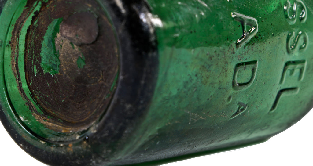 remarkably intact privy-dug c. 1847 light to medium emerald green iron- pontiled mineral water bottle manufactured for philadelphia bottler eugene roussel