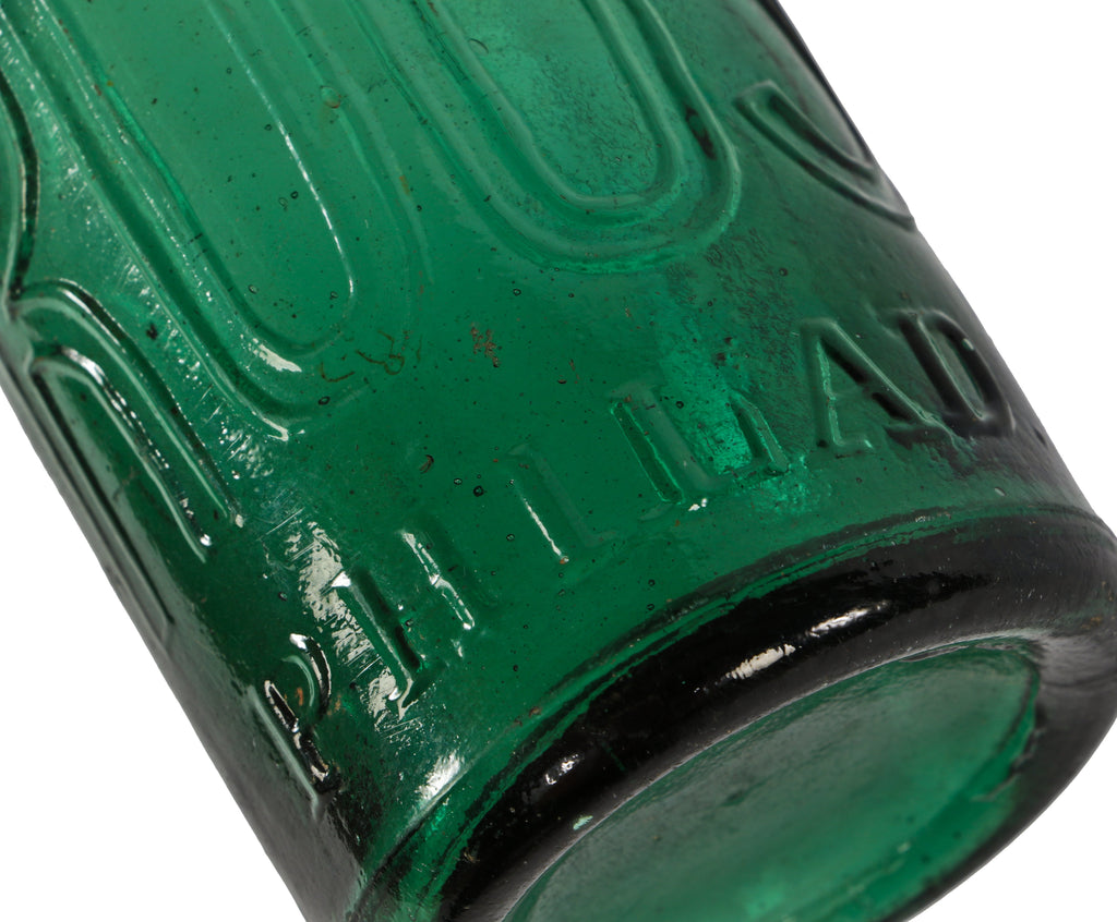 original and intact mid-nineteenth century antique american emerald green glass iron-pontiled soda bottle manufactured for philadelphia bottler eugene roussel.