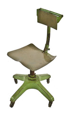 all original and fully functional original antique american industrial depression era low-lying all-metal factory office "posture-chair" with intact bassick swivel casters