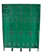 one of three matching c. 1919-1925 antique american industrial oversized heavily compartmentalized green painted riveted joint freestanding steel locker from a chicago factory