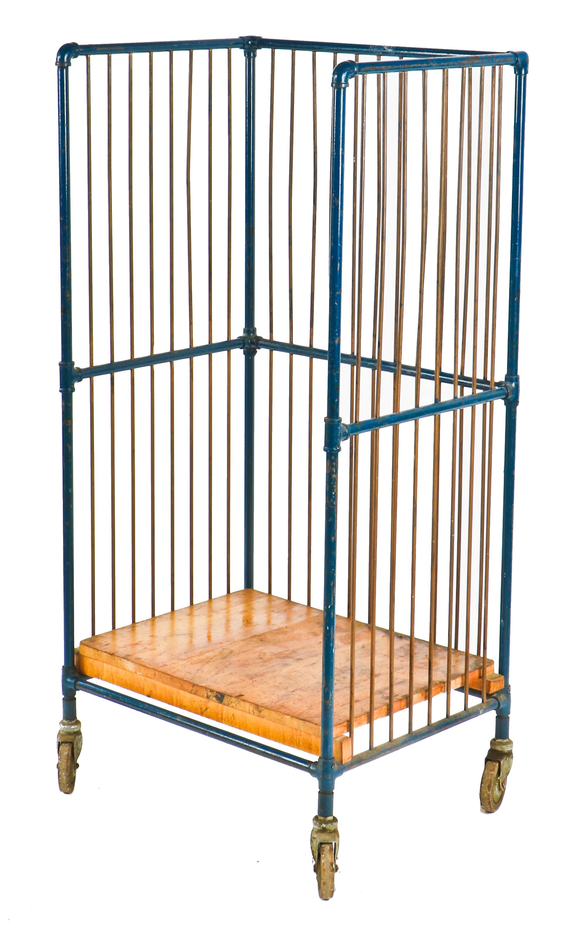 original vintage american industrial mobile tubular steel robust bindery cart with unusual copper rods and multiple pipe fittings containing an old blue paint finish
