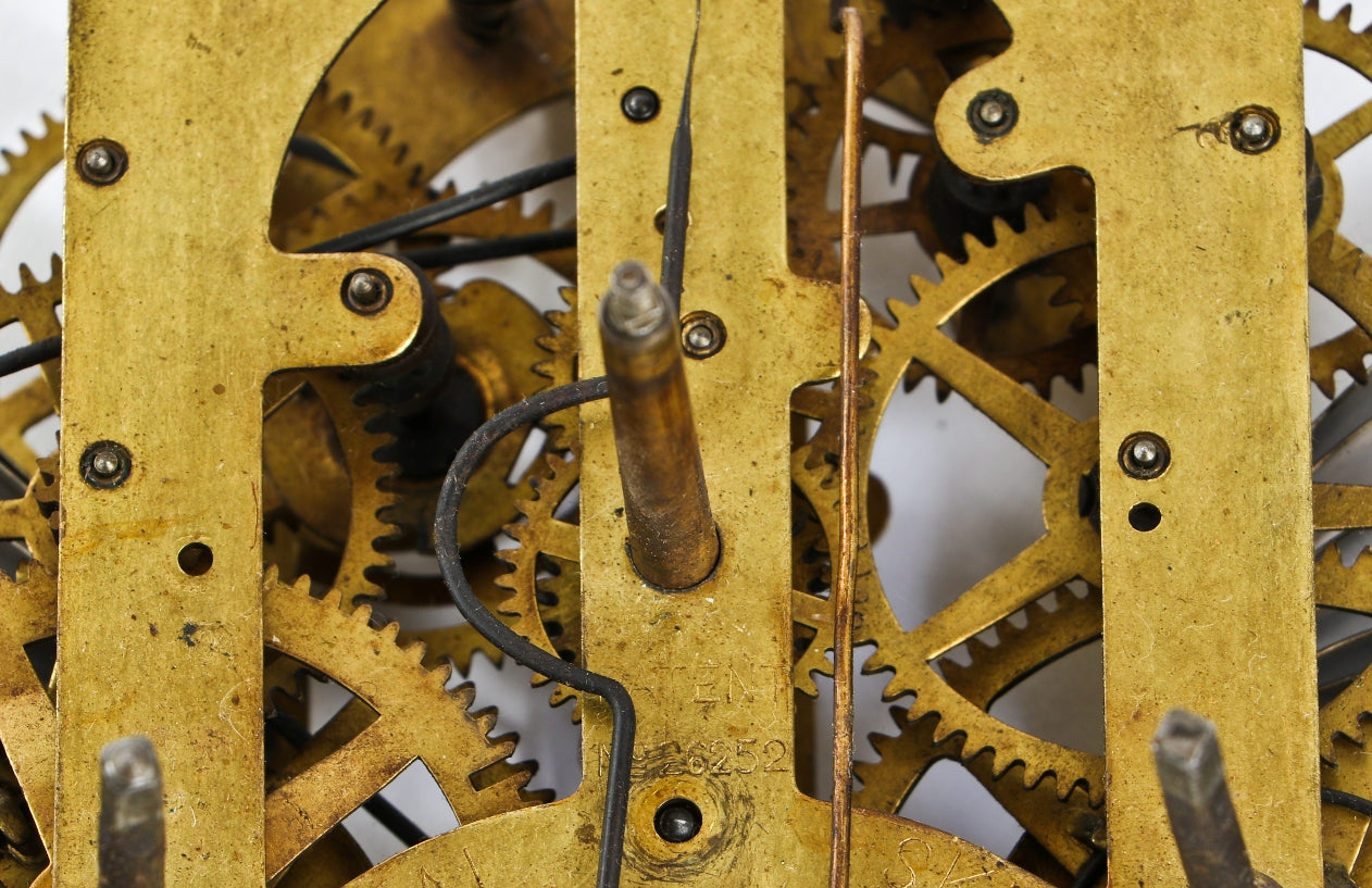 vintage american industrial or "steampunk" brass and steel wind-up wall clock gear and ratchet assemblage with opposed unwound springs