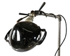 repurposed vintage american industrial freestanding three-legged threaded steel pipe reading or floor lamp with depression era adjustable police cruiser spotlight