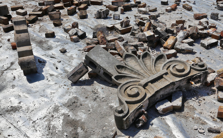 two original matching elegantly designed early 20th century standard brewery corner saloon carved limestone exterior roofline brackets or corbels with age appropriate wear