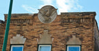pair of identical early 20th century antique american carved solid limestone historic standard brewery saloon corner building roofline ornament with volutes
