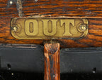 one of two virtually identical early 20th century antique american varnished oak wood wall-mount factory "out" heavily compartmentalized time card rack