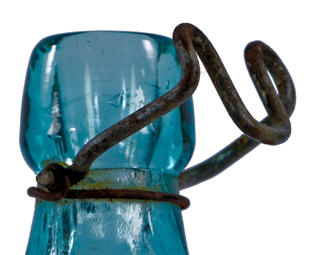 original chicago privy dug mid-1870's blue aqua glass embossed soda bottle with intact wire bail manufactured for chicago bottlers charles and william hausburg.