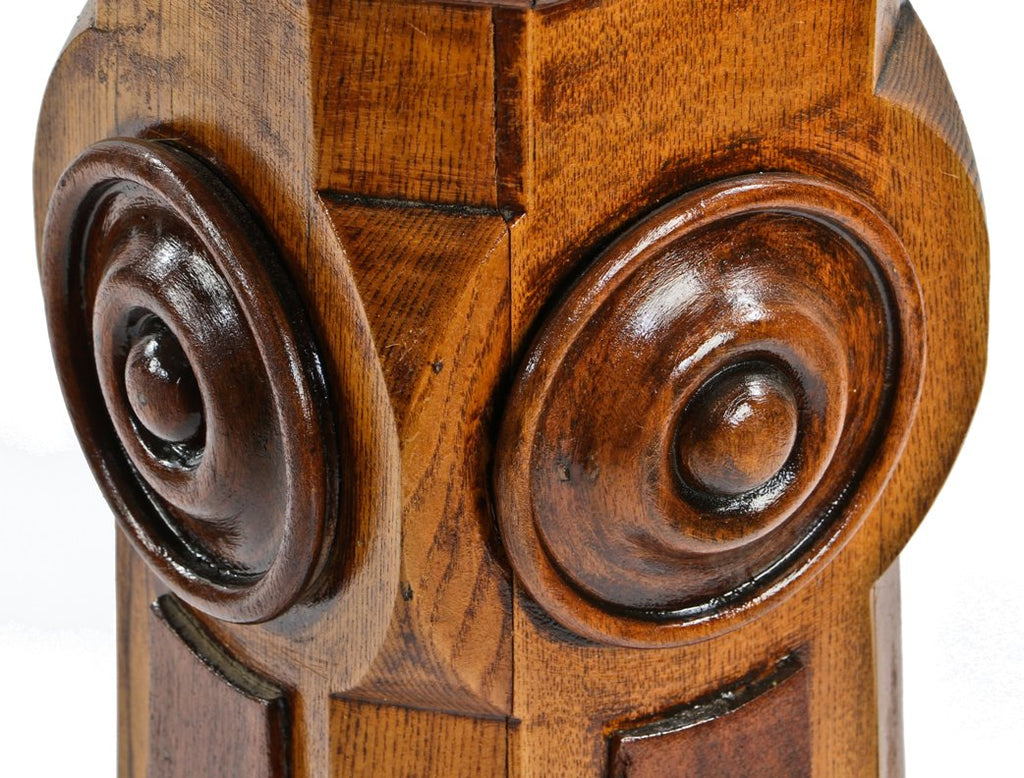 single structurally sound and finely crafted 19th century varnished oak and black walnut wood freestanding newel post with rondels and pyramidal-shaped top