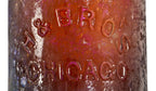 exceptionally rare c. early 1870's heavily irridized amber champagne style bottle manufactured for the hausburg brothers in chicago, il.