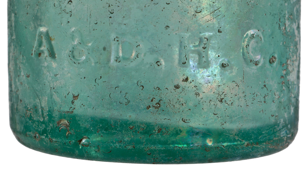 rare and intact privy dug light green teal pony style soda bottle with applied blob top manufactured for chicago bottlers august, william, and frederick lang.