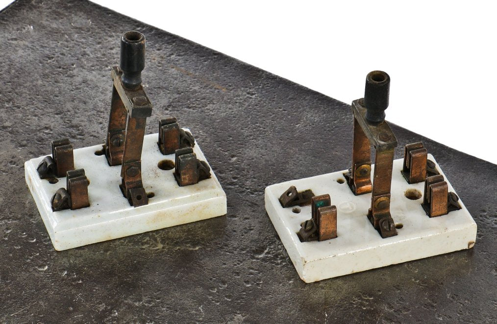 pair of original antique american industrial ceramic and copper double pull jack knife battery "710" switches manufactured for trumbull electric.