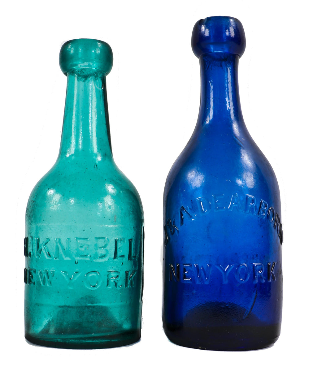 all original hard to find c. 1849-1853 dark cobalt blue iron-pontiled privy dug soda bottle manufactured for john and alexander dearborn in new york.