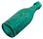 rare original and intact emerald or teal green glass sand pontiled  eugene roussel soda or mineral water bottle with oversized block lettering