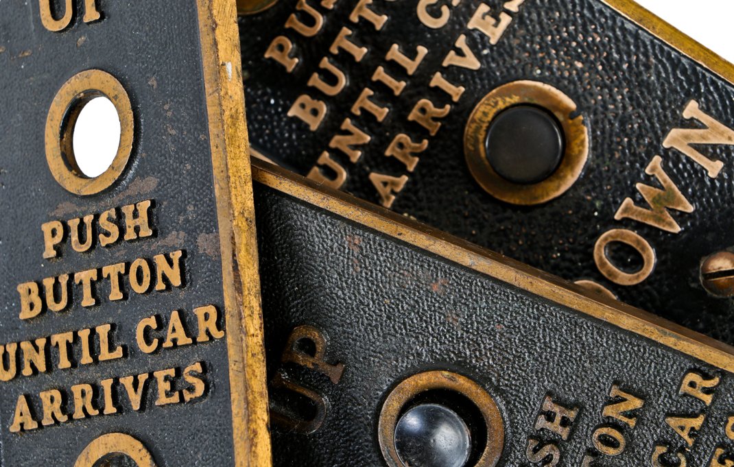 one of three matching original c. 1920's american antique industrial brass-plated cast bronze flush mount elevator cab or car push button "call" plaque with baked black enameled inlay